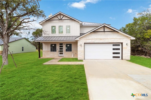 view of front facade featuring a garage, a front yard, and a porch