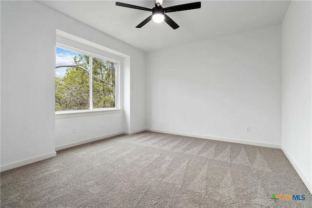 carpeted empty room with ceiling fan