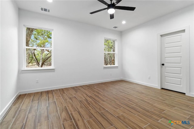 spare room with ceiling fan