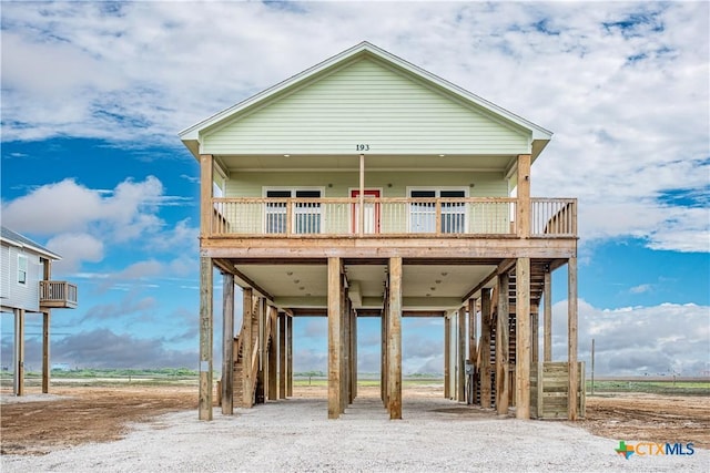 193 Powderhorn Ln, Port Lavaca, TX 77979 - rear view of property with stairs and a carport