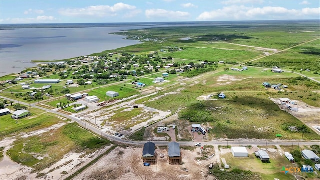 aerial view with a rural view and a water view