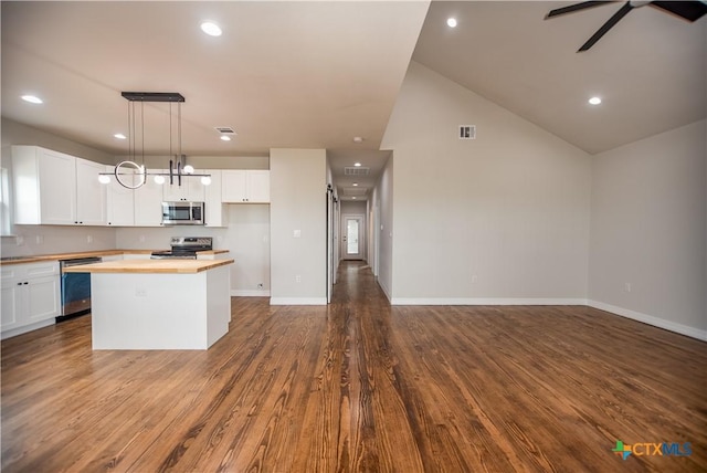 193 Powderhorn Ln, Port Lavaca, TX 77979 - spare room featuring baseboards and dark wood finished floors