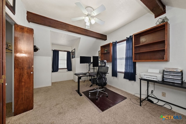 office featuring a wealth of natural light, ceiling fan, light colored carpet, and vaulted ceiling with beams