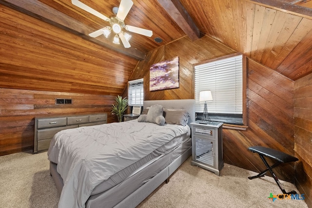 bedroom featuring wood walls, light carpet, wooden ceiling, ceiling fan, and lofted ceiling with beams