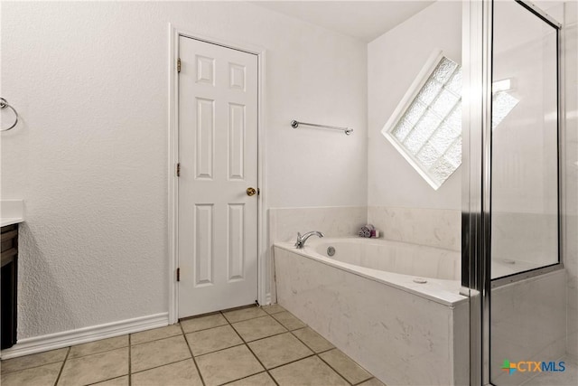 bathroom with tile patterned floors, vanity, and independent shower and bath