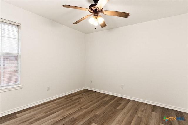 unfurnished room with dark hardwood / wood-style floors and ceiling fan