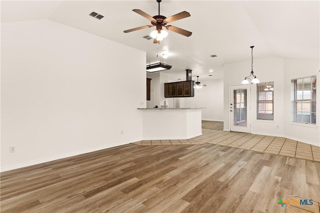 unfurnished living room featuring ceiling fan, light hardwood / wood-style floors, and lofted ceiling