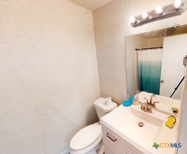 2011 Valley Oaks Dr, Harker Heights, TX 76548 - bathroom featuring vanity and a textured wall