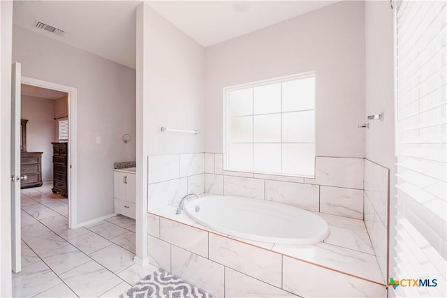 full bathroom with a bath, marble finish floor, vanity, and visible vents