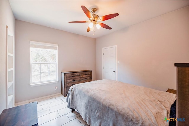 bedroom featuring light tile patterned floors and ceiling fan