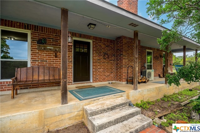 doorway to property featuring a porch