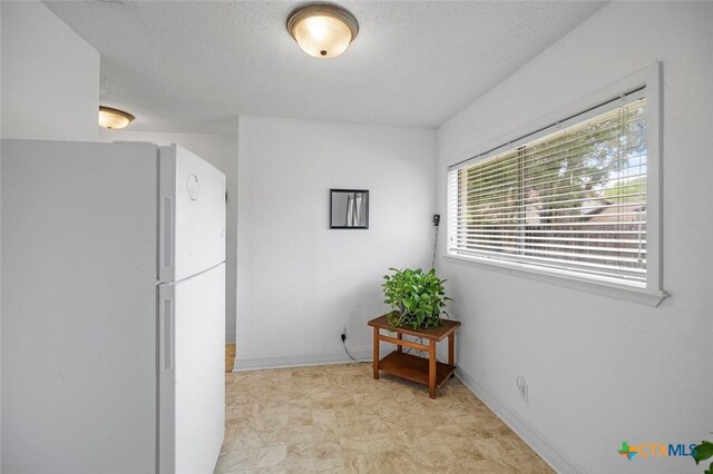 205 Magdalena Dr, Victoria, TX 77904 - hall with baseboards and a textured ceiling