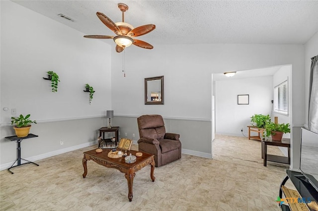 205 Magdalena Dr, Victoria, TX 77904 - sitting room with light floors, a ceiling fan, a textured ceiling, and lofted ceiling