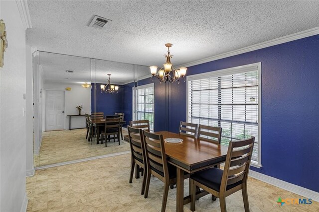 205 Magdalena Dr, Victoria, TX 77904 - dining space with an inviting chandelier, crown molding, a textured ceiling, and visible vents