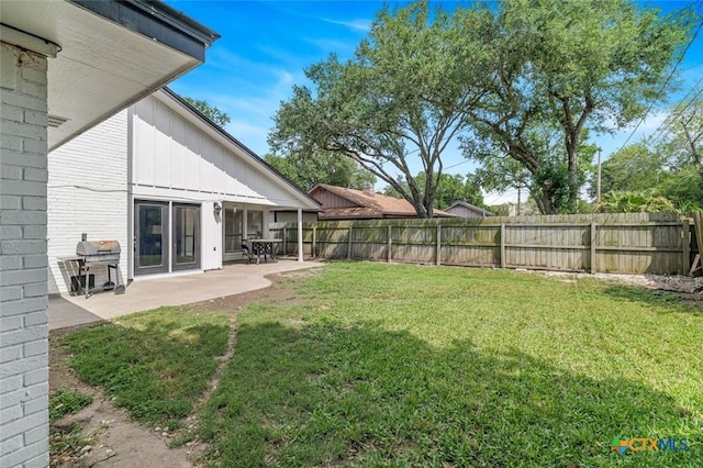 205 Magdalena Dr, Victoria, TX 77904 - view of yard featuring a patio and a fenced backyard