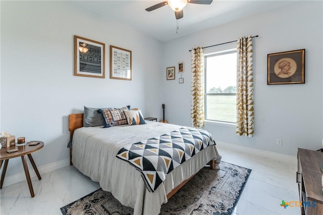 bedroom with marble finish floor, ceiling fan, and baseboards