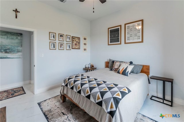 bedroom featuring a ceiling fan, marble finish floor, visible vents, and baseboards