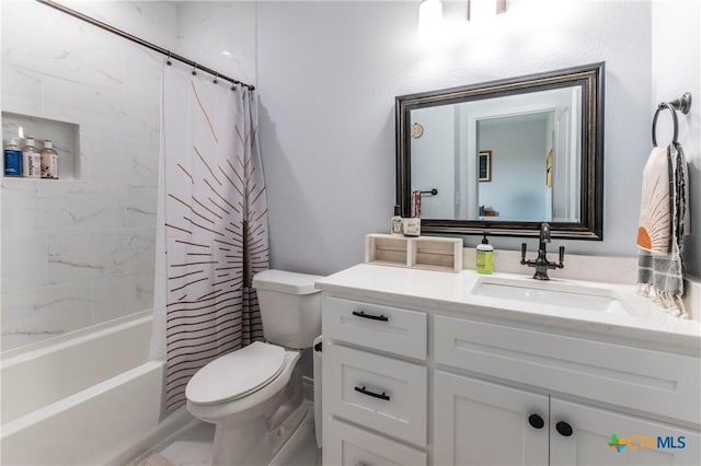 full bath with vanity, toilet, and shower / bath combo with shower curtain