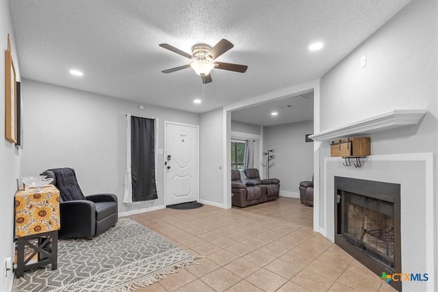 4103 Koala Dr, Killeen, TX 76543 - living area with light tile patterned floors, ceiling fan, recessed lighting, and a fireplace