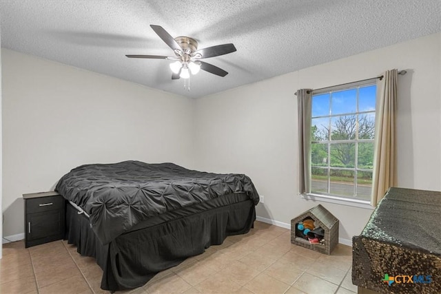 4103 Koala Dr, Killeen, TX 76543 - bedroom featuring light tile patterned floors, a textured ceiling, baseboards, and ceiling fan