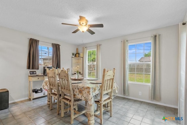 4103 Koala Dr, Killeen, TX 76543 - dining area with light tile patterned flooring, a textured ceiling, baseboards, and ceiling fan