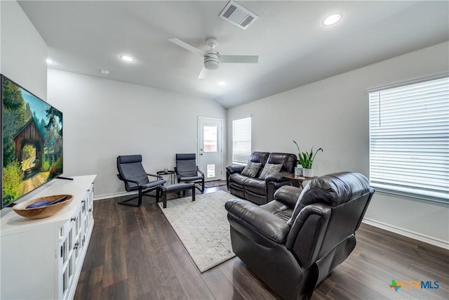 living room with lofted ceiling, dark wood-style flooring, visible vents, and recessed lighting