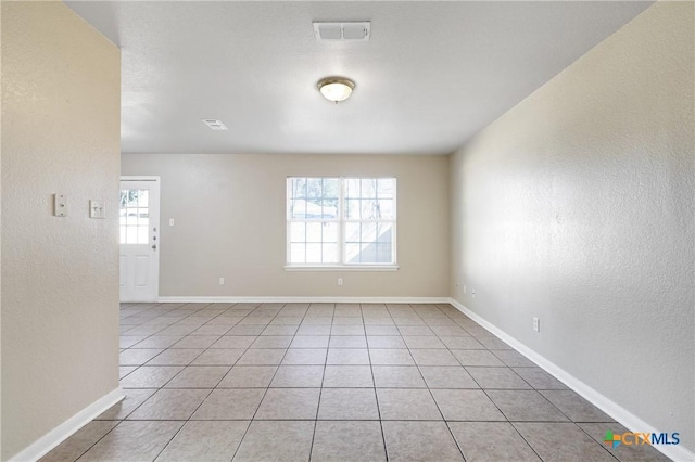 view of tiled spare room