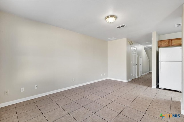 view of tiled spare room