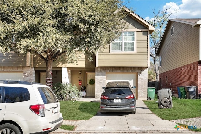 view of front of home with a garage and a front yard