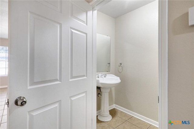 bathroom with tile patterned flooring