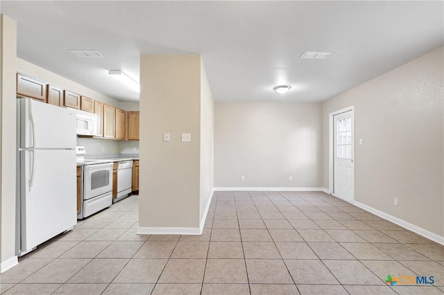 kitchen featuring white appliances and light tile patterned floors