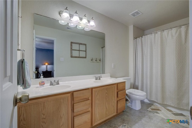 bathroom featuring vanity, toilet, and a shower with shower curtain