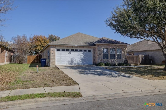 single story home with a garage and a front yard