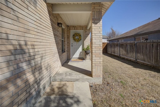 doorway to property with a patio