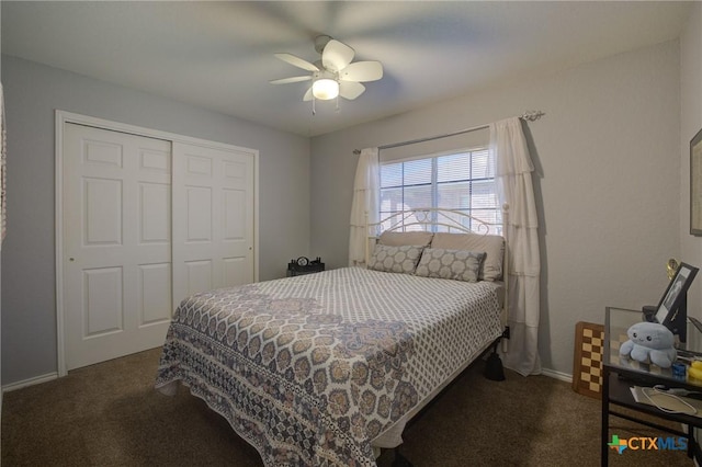 carpeted bedroom with ceiling fan and a closet