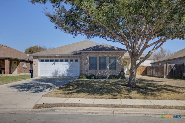 ranch-style home with a garage and a front lawn