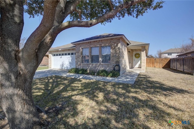 single story home featuring a garage and a front yard