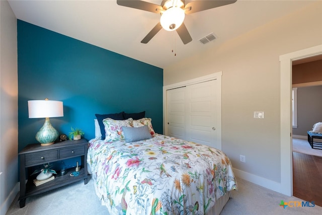 1175 Lavaca, Canyon Lake, TX 78133 - bedroom with baseboards, a closet, carpet flooring, a ceiling fan, and visible vents