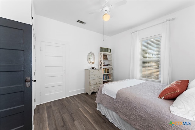 bedroom featuring dark hardwood / wood-style flooring and ceiling fan