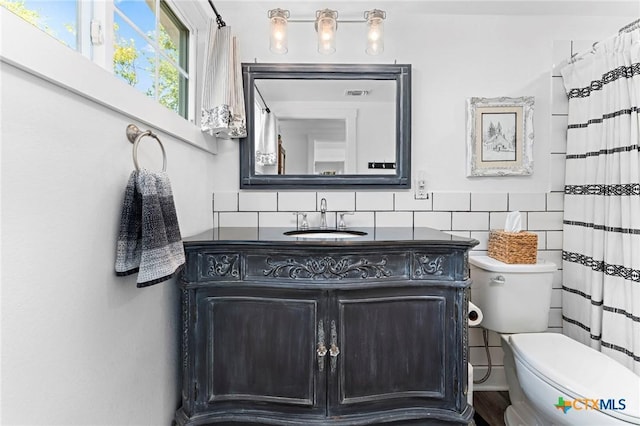 8410 Alaska Ave, Temple, TX 76502 - bathroom with vanity and tile walls