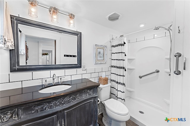 bathroom featuring decorative backsplash, vanity, toilet, and a shower with curtain