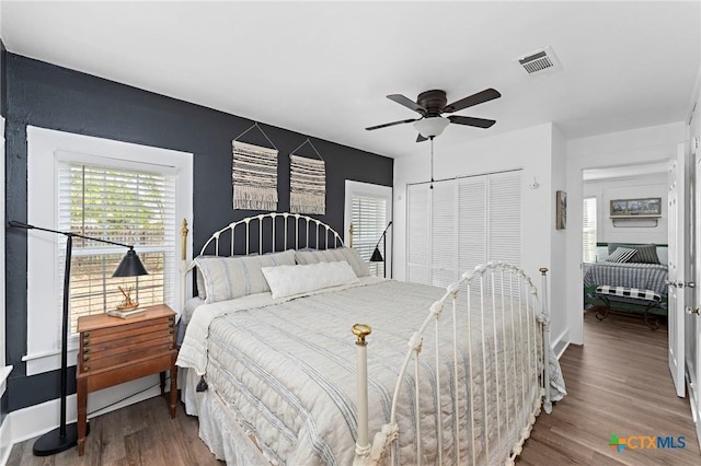 8410 Alaska Ave, Temple, TX 76502 - bedroom with wood finished floors, a closet, and ceiling fan