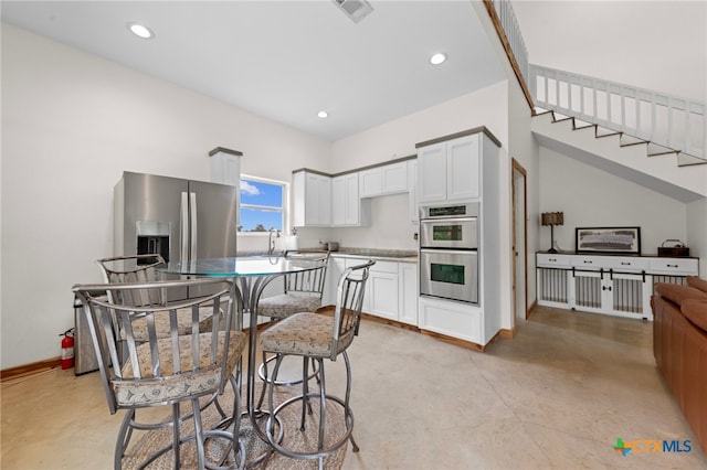 kitchen with white cabinets, sink, and appliances with stainless steel finishes