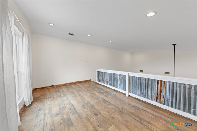 unfurnished room featuring light hardwood / wood-style floors