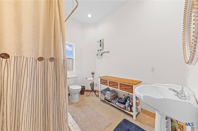 bathroom featuring sink and toilet