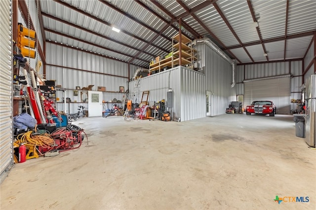 garage with stainless steel fridge