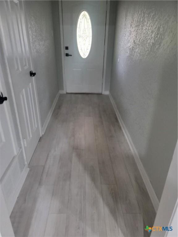 4106 Ermine Trl, Temple, TX 76504 - doorway to outside with wood finished floors and baseboards