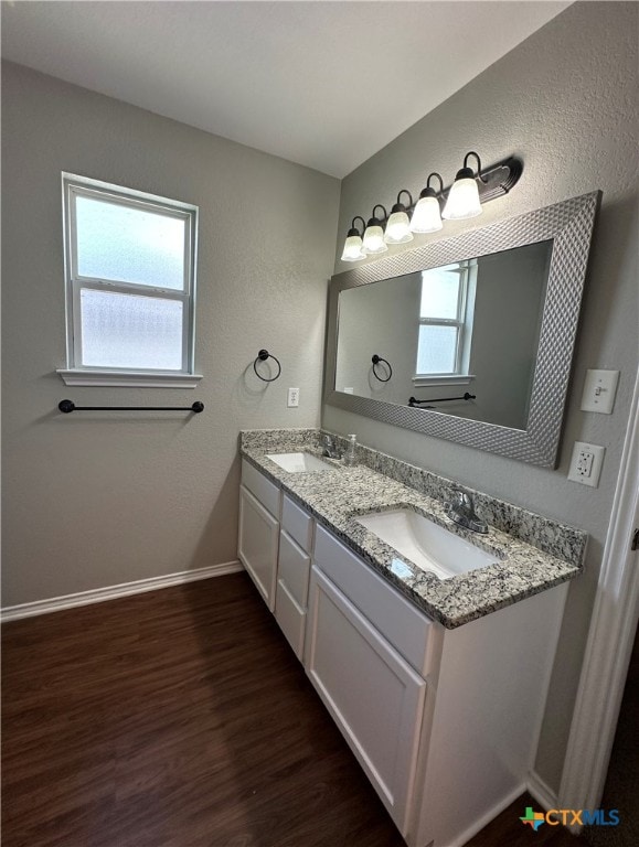 bathroom featuring hardwood / wood-style floors and vanity