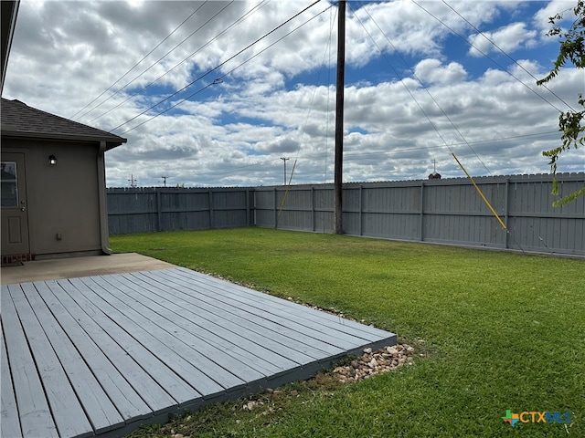 view of yard with a wooden deck