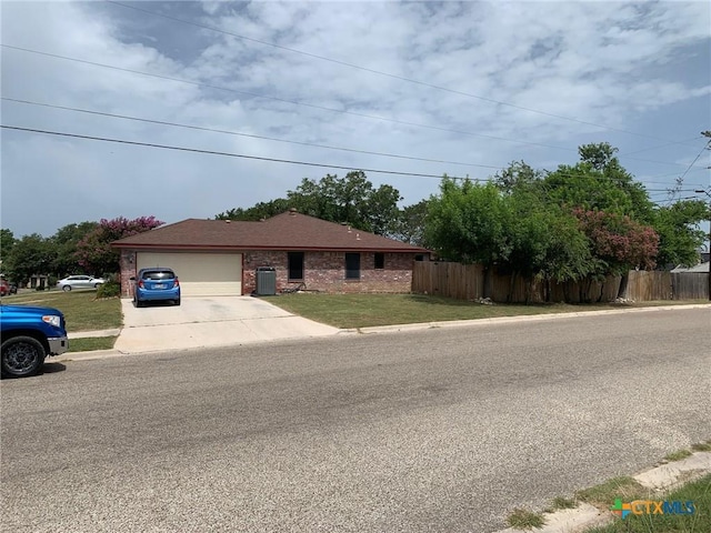 3002 Veterans Ave, Copperas Cove, TX 76522 - ranch-style house with driveway, an attached garage, and brick siding